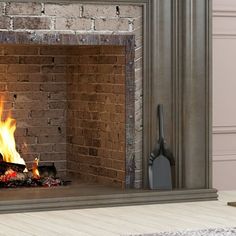 a brick fireplace with fire burning in it