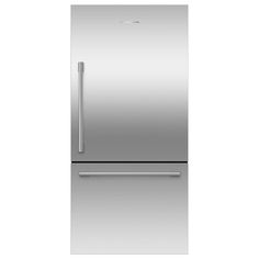 a silver refrigerator freezer sitting on top of a white counter