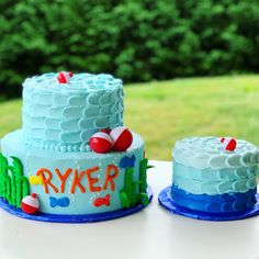 two cakes sitting on top of a table next to each other