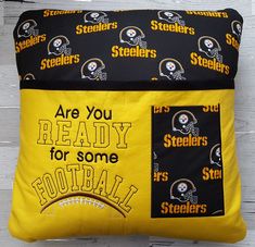 a pillow that has the words are you ready for some football? and is on display