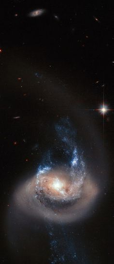 two spiral galaxy like objects in the sky