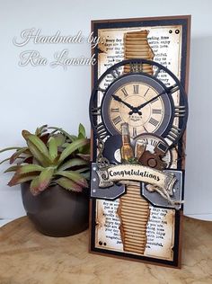 an altered clock is sitting on a table next to a potted succulent