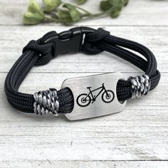 "Mountain Bike Adventure bracelet.. rugged and fashionable bracelet, goes wherever your adventures take you! Create a fashion statement hiking the trails, paddling the rivers, a night on the town, or just a day at the office! durable parachute style cord with wrap side accents. Side release durable acrylic clasp, easy on and off Brushed Stainless steel UP cutout charm with deep etched bike image Non tarnish stainless steel Wear biking, or just as a fashion statement Washable, durable military gr Casual Outdoor Bracelet, Durable Adjustable Bracelet For Outdoor, Adjustable Durable Bracelet For Outdoor, Adjustable Durable Bracelets For Outdoor Activities, Durable Paracord Braided Bracelet For Outdoor, Adjustable Casual Bracelet For Outdoor Activities, Casual Adjustable Bracelet For Outdoor Activities, Casual Adjustable Bracelets For Outdoor Activities, Casual Adjustable Bracelets For Outdoor Wear