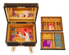 three wooden boxes with decorative items in them