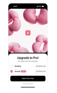 an iphone screen with the text upgrade to pro, and pink donuts on it