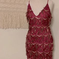 Score This Spicy Burgundy Mini Dress With A Deep V-Neck. The Back Is Relatively Low With Delicate Straps. Some Of The Sequins May Have Fallen Off But It’s Still Got Plenty Of Fire To Burn Down The Town!Wear It To A Salsa Club, Wear It To A Party, For Ya Boo Thing, For That Situationship Thing Either Way You’ll Be A Hottie In This Number. Length: 31”, Waist: Approx 14.5”. Come Check Out My Closet! Great Gatsby Hoco Dresses, Magenta Sequin Dress, Mini Party Dress Night, Holiday Burgundy V-neck Dress, Burgundy V-neck Mini Dress For Party, Glamorous Red V-neck Mini Dress, Burgundy V-neck Mini Dress For Summer, Summer Burgundy V-neck Mini Dress, 20s Fashion Women