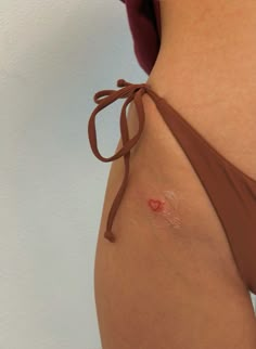 Red Fine Line Tattoo Ideas, Panty Line Tattoos For Women, Red Dainty Tattoos, Tiny Red Tattoo, Panty Line Tattoo, Tattoo On Hip Bone, Kiss Tattoo, Blood Tattoo, Kiss Tattoos