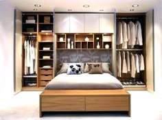 an image of a bedroom setting with closets and bed in the foreground,