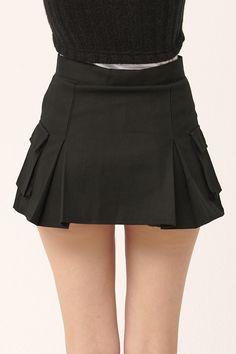 Micro-mini skirt look with lining shorts underneath Faux pocket on the sides Product Specification 97% Cotton 3% Spandex Flat measurement (XS/S) Waist 34cm / hip 43cm / length 35cm (S/M) waist 35.5cm / hip 41cm / length 33cm Professional Clean Only / Do Not Tumble Dry Model's height is 6' 8" (175cm) Bust 31in Waist 23in Hip 34in and wearing XS/S Made in Korea