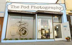 a store front with the words the pod photography on it