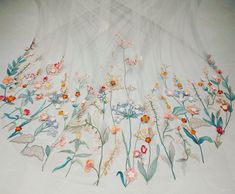 an artistically designed table cloth with flowers on it