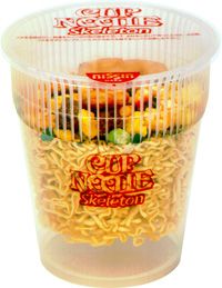 a plastic container filled with noodles and vegetables