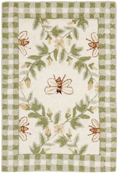 a green and white checkered rug with a bee on it