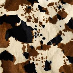 an animal print fabric with brown and white spots