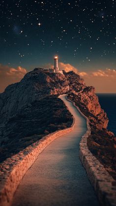 Majestic lighthouse on mountain with curved road to the top - clear night with starry sky.  #lighthouse #mountains #road #night #sky #starry Destination Unknown, Space And Astronomy, Mobile Wallpaper