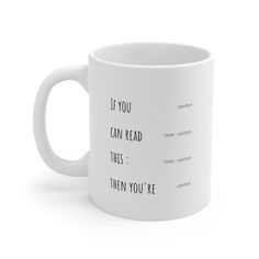 a white coffee mug with the words if you can't read this, then you're