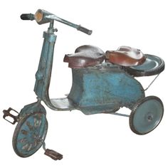 an old blue scooter is shown on a white background