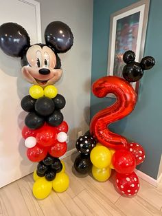 mickey mouse balloon decorations in the hallway for a 2nd birthday or baby's first birthday