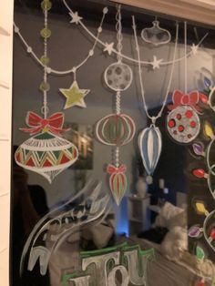 a window decorated with ornaments and the word joy