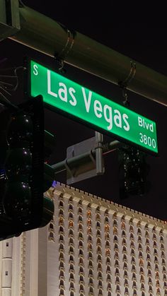 the street sign for las vegas blvd is green