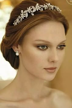 a woman wearing a tiara in a room