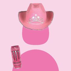 a pink cowboy hat next to a can of monster energy drink on a pink background