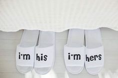 three pairs of white slippers that say i'm his and i'm hers