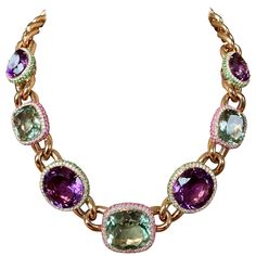 Statement necklace in 18 Karat rose gold, set with 4 Amethysts weighing 68,26 ct. All 4 Amethysts are surrounded by Diamonds and Tsavorites. 3 Prasiolites weighing 51,01 ct of wich each is surrounded by pink Sapphires and Tsavorites. Total 208 pink Saphires 4.02 ct Total of 292 Tsavorites 5.60 ct Total of 250 brilliant cut Diamonds 3,71 ct, G color, vs clarity. The necklace can be worn in 2 different lengths. Traditional Luxury Multicolor Jewelry, Luxury Multicolor Women's Necklace, Traditional Multicolor Luxury Necklaces, Luxury Multicolor Jewelry With Halo Setting, Champagne Diamond Necklace, Runway Necklace, Bold Statement Necklaces, Horseshoe Pendant, Horseshoe Necklace