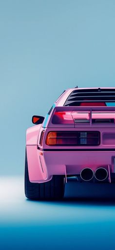 the back end of a pink car on a blue background