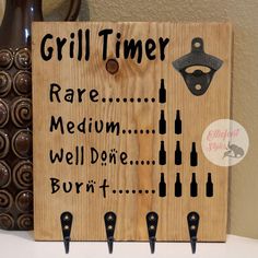 a wooden sign that says grill time rare medium well done burn't on it