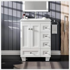 a white bathroom vanity with a mirror above it