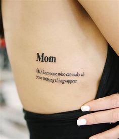 a woman with a tattoo on her back saying mom is someone who can make all your missing things appear