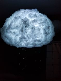 a cloud is floating in the air with water droplets