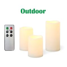 three lit candles with remote control sitting next to each other on a white background and the words outdoor written in green