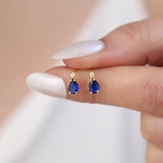 Introducing the epitome of elegance and timeless beauty: our 14K Solid Gold Solitaire Real Diamond Drop Stud Earrings, featuring a stunning sapphire, the birthstone of September. Each earring is meticulously handcrafted to showcase the vivid blue sapphire, symbolizing wisdom, virtue, and good fortune, making it not only a luxurious accessory but also a meaningful gift. Crafted from the finest 14K solid gold, these earrings highlight a solitary, brilliantly cut real diamond artfully placed above Teardrop Sapphire Earrings For Anniversary, Dainty Pear-shaped Earrings For Anniversary, 14k Gold Sapphire Earrings For Anniversary, Gift Sapphire Diamond Earrings, Small Sapphire Earrings, Sapphire Single Earring As Gift, Dainty Sapphire Earrings For Anniversary, Gold Sapphire Earrings Gift, Pear-shaped Sapphire Earrings For Anniversary