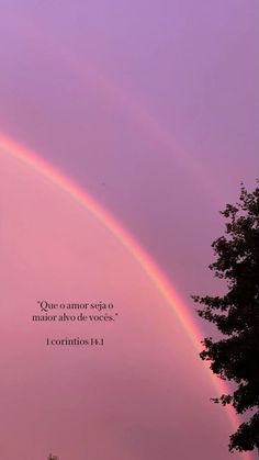 a rainbow in the sky with a bible verse