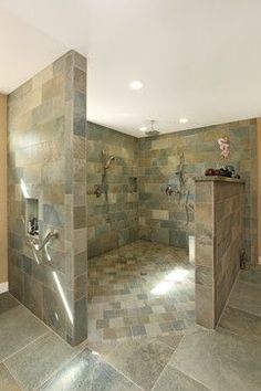 a large bathroom with tiled walls and floor