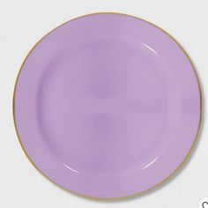 a purple plate with gold trim on the rim is shown in front of a white background