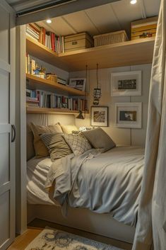 a bedroom with a bed, bookshelf and pictures on the wall above it