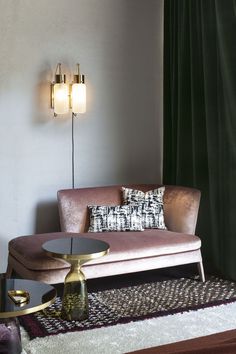 a living room scene with focus on the couch and coffee table in the foreground