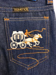 "Vintage Unisex Kids 70's NWT, Unworn, Young Maverick, Western, Denim, Dark Wash, Jeans (6X) These unsiex jeans come in a dark blue denim, with gold stitching detail, four pockets with colorful sewn colorful stagecoach patchwork on the back pocket. 80% Cotton 20% Polyester Made in USA *These jeans are in mint condition and have the original tags attached. Size: (6X Slim) Waist: 20 1/2\" Hips: 11\" Inseam: 20 1/2\" Leg Opening: 7\" Weight: 10 oz *Follow FreshandSwanky on Instagram" Retro Cotton Jeans For Rodeo, Vintage Dark Wash Jeans For Rodeo, Vintage Denim Jeans For Rodeo, Vintage Cotton Jeans For Rodeo, Vintage Kids, Boys Jeans, Dark Wash Jeans, Wash Jeans, Vintage Pattern