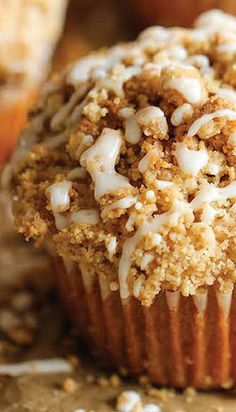 a muffin topped with white frosting and crumbs