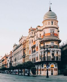 an empty city street lined with tall buildings