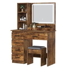 a wooden vanity with a mirror, stool and medicine cabinet on it's side