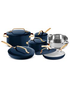 an assortment of pots and pans with gold handles on the bottom, in blue