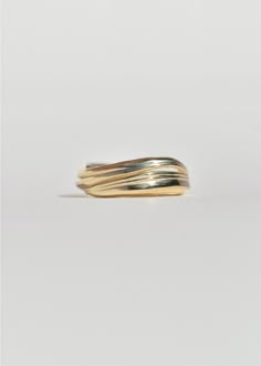 A substantial undulating band, the Soft Wave Ring feels familiar and comfortable, like an old friend. Elegant striations encircle the ring, even opening between the lines at one point to offer a glimpse of the wearer’s finger. To design her inaugural fine jewelry collection, Leigh searched for years until she found the perfect wax-working method to translate her design sensibility to a finer scale. Working in an ancient Japanese formulation, a combination of beeswax and pine resin, Leigh artfull Modern Twist Wide Band Rings With Polished Finish, Timeless 14k Gold Dome Ring With Open Band, Modern Twist 14k Gold Bypass Ring With Polished Finish, 14k Gold Stackable Rings With Modern Twist, Modern Twist 14k Gold Ring With Polished Finish, Modern Twist 14k Gold Stackable Rings With Polished Finish, Elegant Yellow Gold Wavy Rings, Modern Wavy Rings With Polished Finish, Minimalist Yellow Gold Wavy Ring