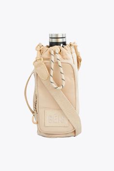 BÉIS 'The Water Bottle Sling' in Beige - Water Bottle Sling For Travel & The Gym Water Bottle Sling, Mini Sling Bag, Bottle Sling, Water Bottle Bag, Sling Pack, Recycle Bag, Workout Bags, Travel Purse, Sling Bags