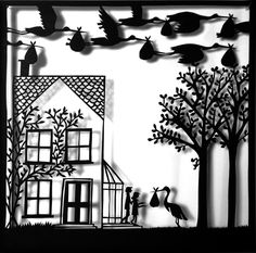 a paper cut out of a house with birds flying over it and trees in the foreground