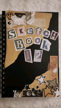 a notebook with the words sketch book 12 written in white and black letters on it