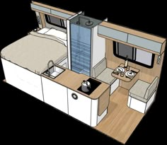 the interior of an rv with a bed, sink and kitchenette in it's center